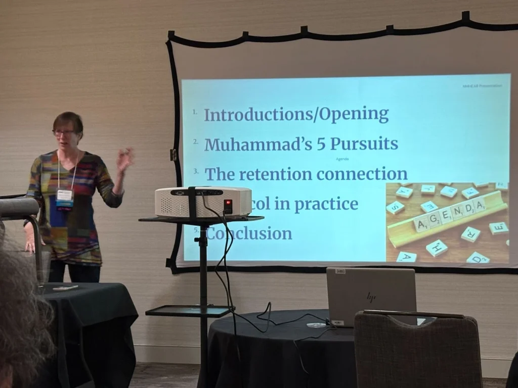 Image of Dr. Debbie Deneen presenting at the NMHEAR conference